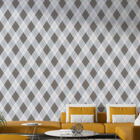 An angled shot of a wall with argyle wallpaper

