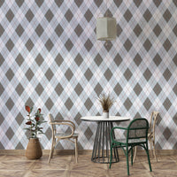 Classic argyle pattern gray and light blue wallpaper on a wall

