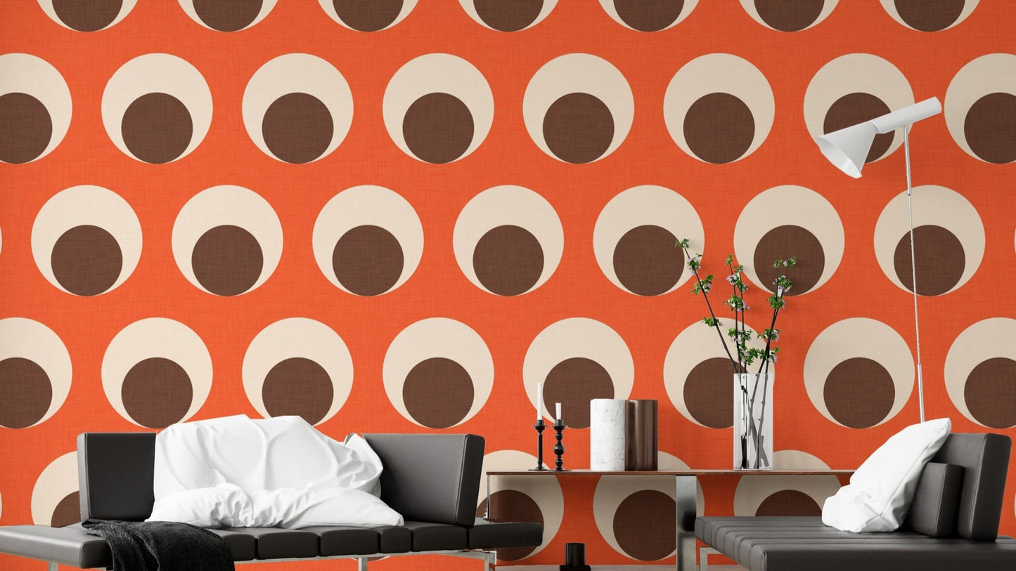 Retro orange dotted wallpaper with eye motifs
