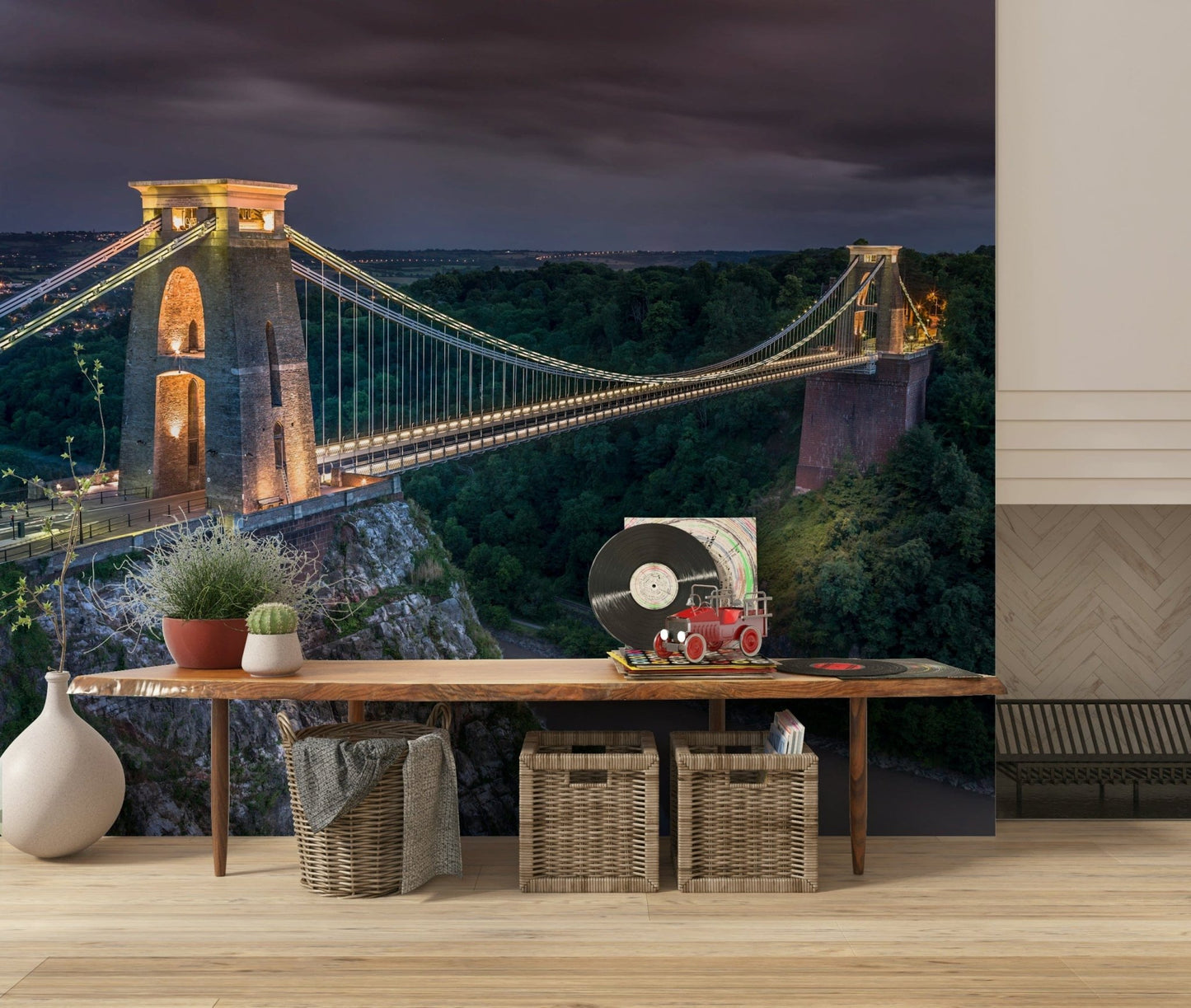 Historical structure mural, brilliant lights define suspension walkway path.