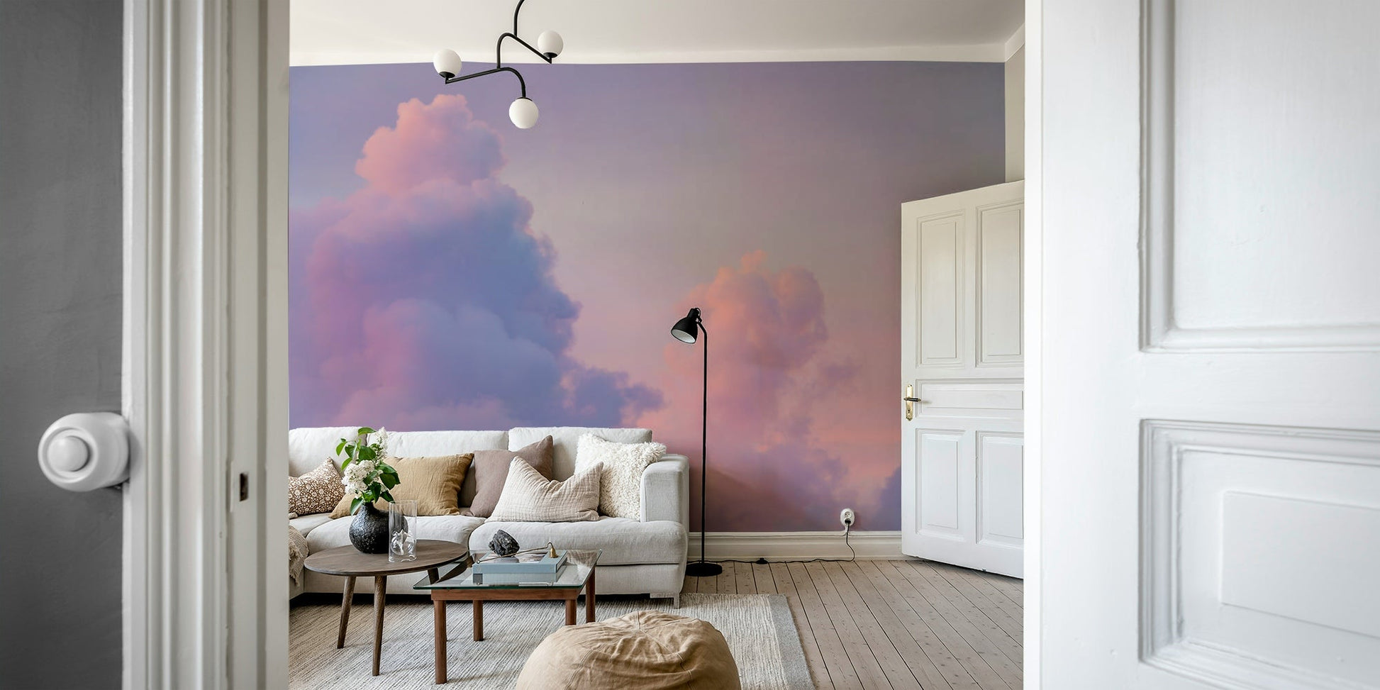 A dreamy pink and purple cloud wall mural for a serene room.

