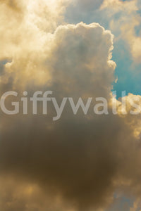 Massive gold cloud crowds the frame above blue, a sky wall mural GD4796
