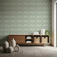 Close-up of cream shell motifs on the sage ground of Coastal Deco Serenity wallpaper
