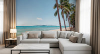 Soft ocean distance behind Coastal Palm Serenity Wall Mural in a calm living space, GD8267