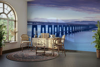 The ocean is visible, with soft waves on the shore.

