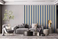 Grey lounge backdrop featuring Coastal Stripes Wallpaper in bold vertical repeats