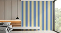 A low bed corner finished with Coastal Stripes Wallpaper in slim stripe detail