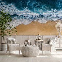 Light-filled sitting area framed by Coastal Surge Wall Mural with foamy surf above, GD8672