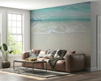 Minimalist coastal wall decor showing gentle sea foam on a bright tropical shore.
