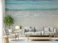 Top-down view of turquoise sea water and white sand beach wallpaper for bright interiors.