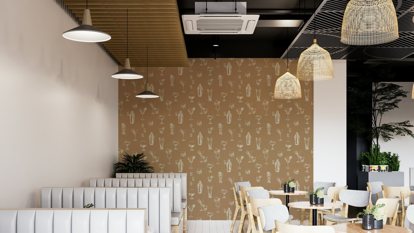 Modern bar area with cocktail-themed wallpaper

