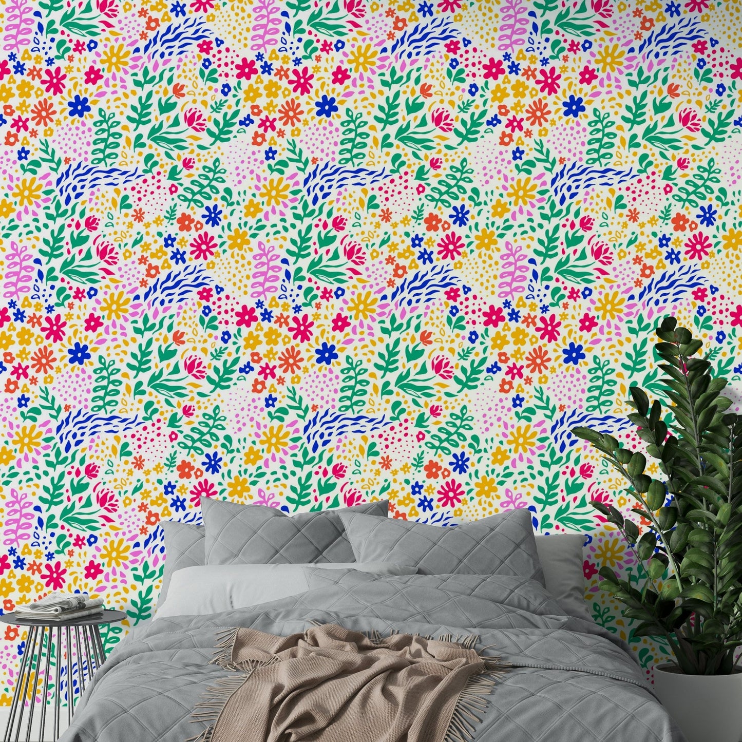 An angled shot of a wall with colorful botanical wallpaper

