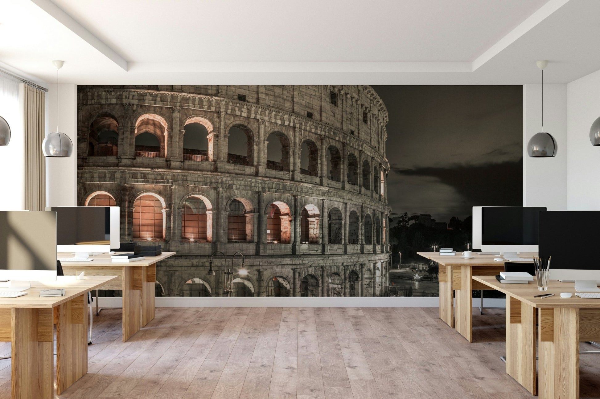 A dramatic wall mural of the Colosseum in Rome.

