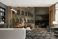 The composition is a close-up view of a section of the Colosseum.

