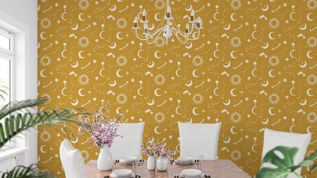 Dreamy yellow mural featuring stars and moons

