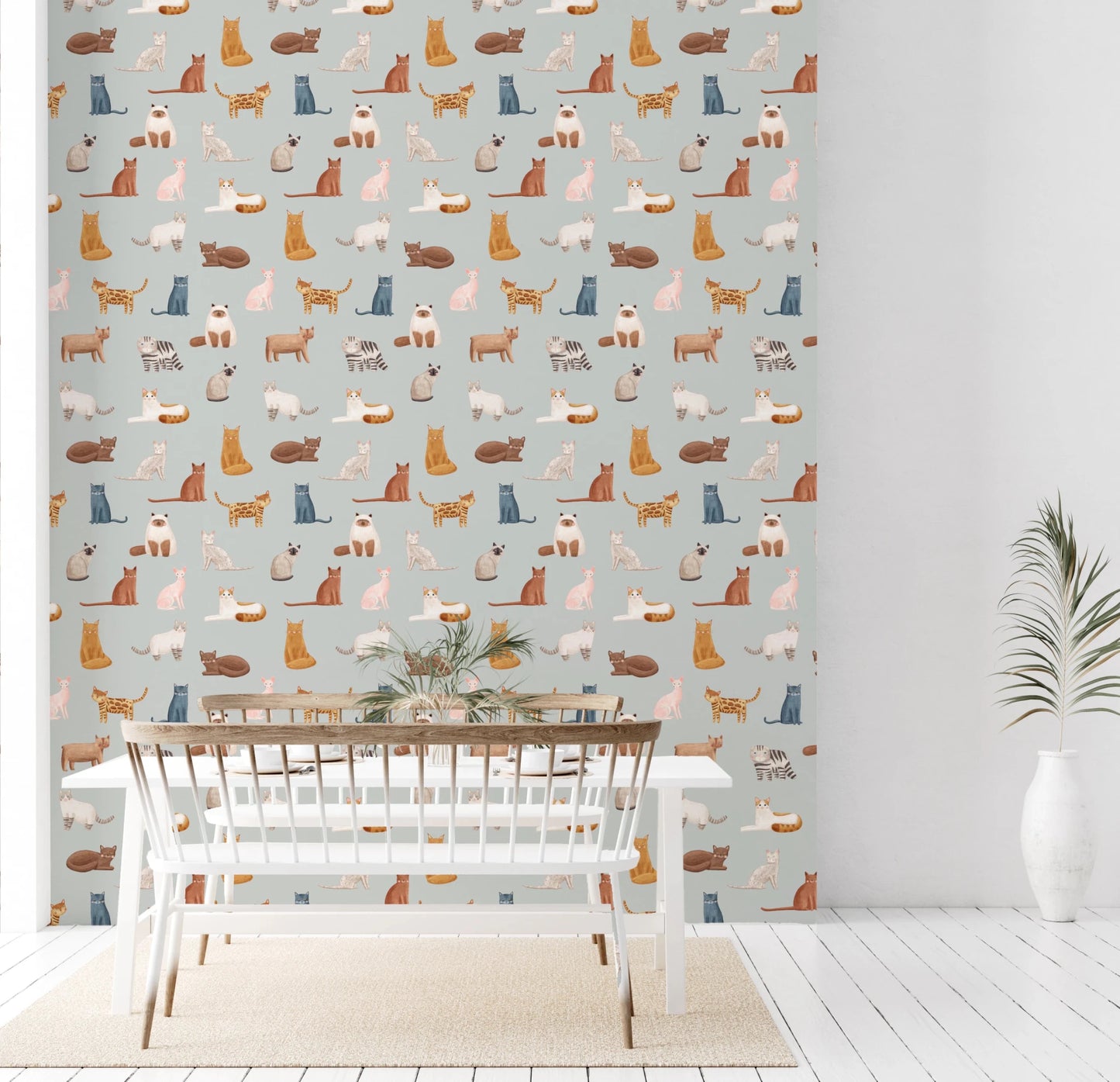 Soft blue cat wallpaper with playful illustrated felines