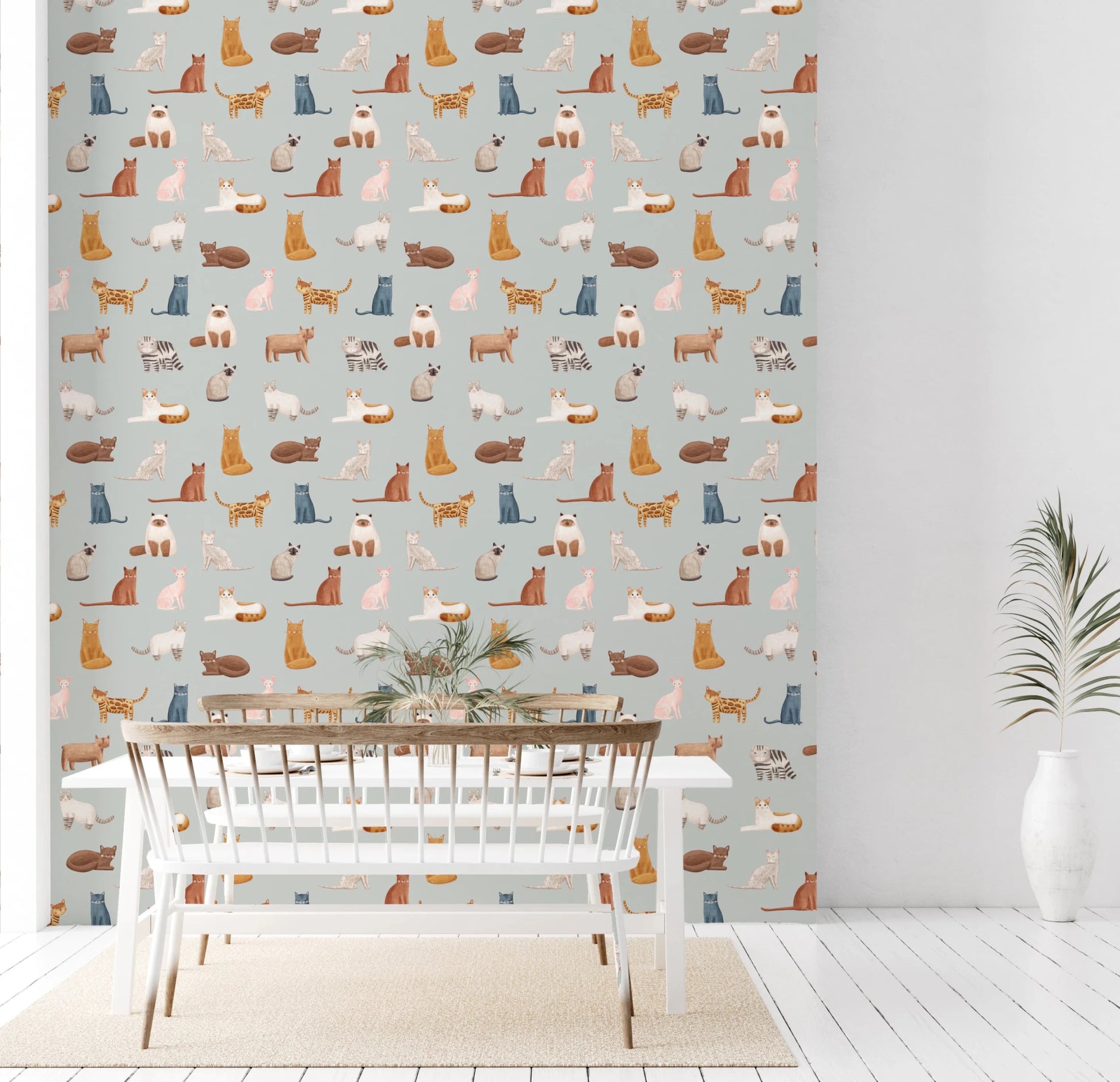 Soft blue cat wallpaper with playful illustrated felines
