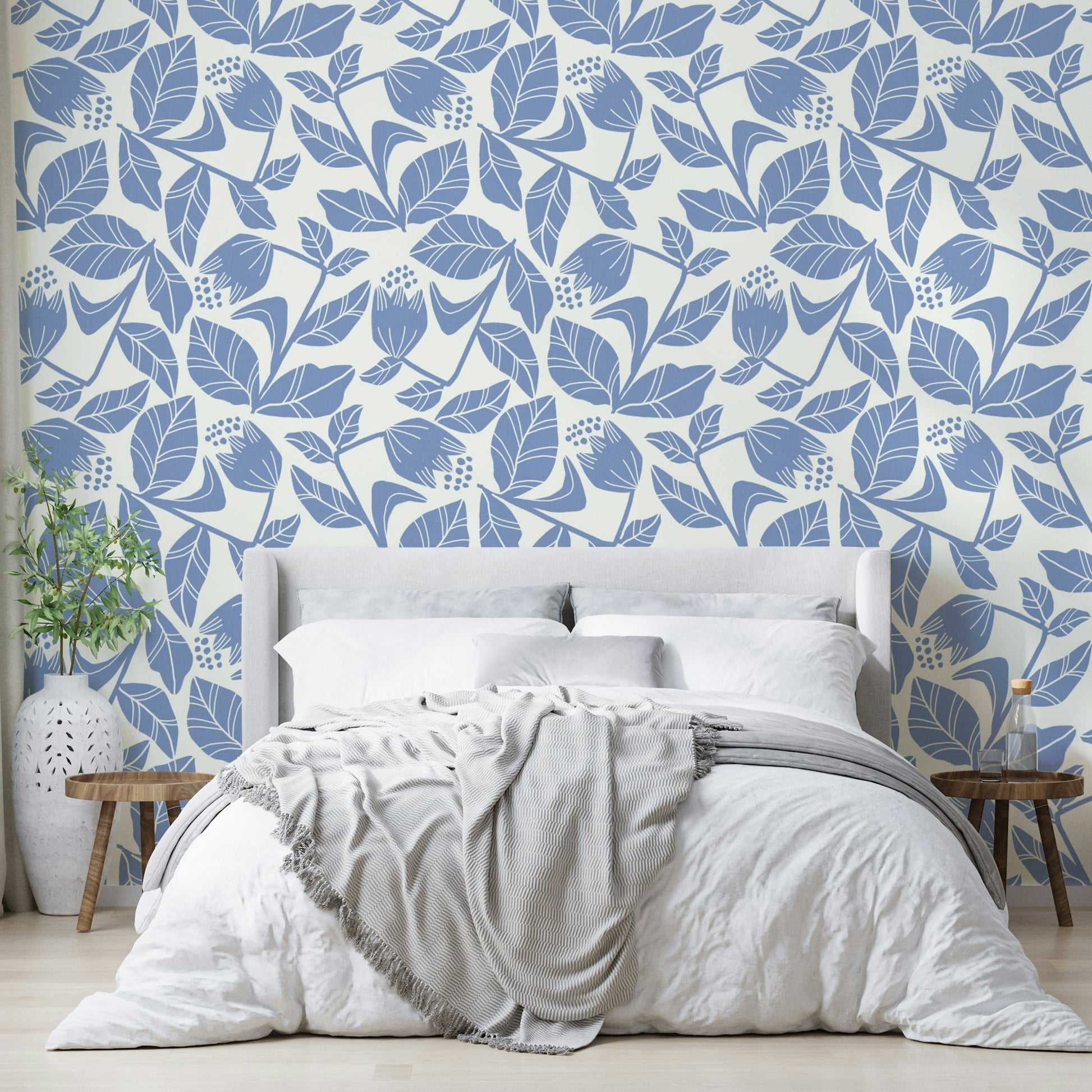 Botanical wallpaper with soft blue flowers

