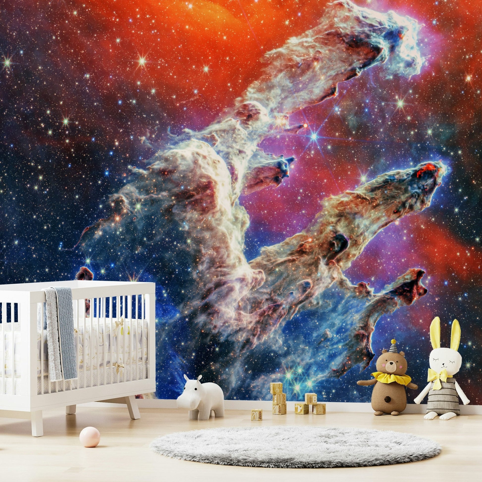 The background is filled with a soft, swirling nebula and twinkling stars.
