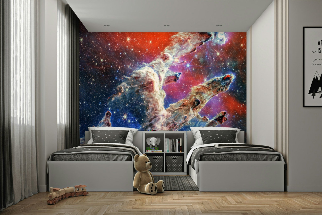 A wide wall mural showing a serene, magical scene of outer space.
