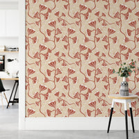 Abstract maroon vines on beige wall

