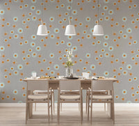 Dining space styled with warm linen dot wallpaper and soft neutral wooden furniture