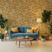Living room styled with Cozy Scandi Folk Leaf Vine Honey Mustard wallpaper and blue sofa, GD8542