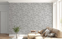 Soft lounge corner styled with Cozy Scandi Folk Leaf Vine Warm Linen wallpaper, GD8545