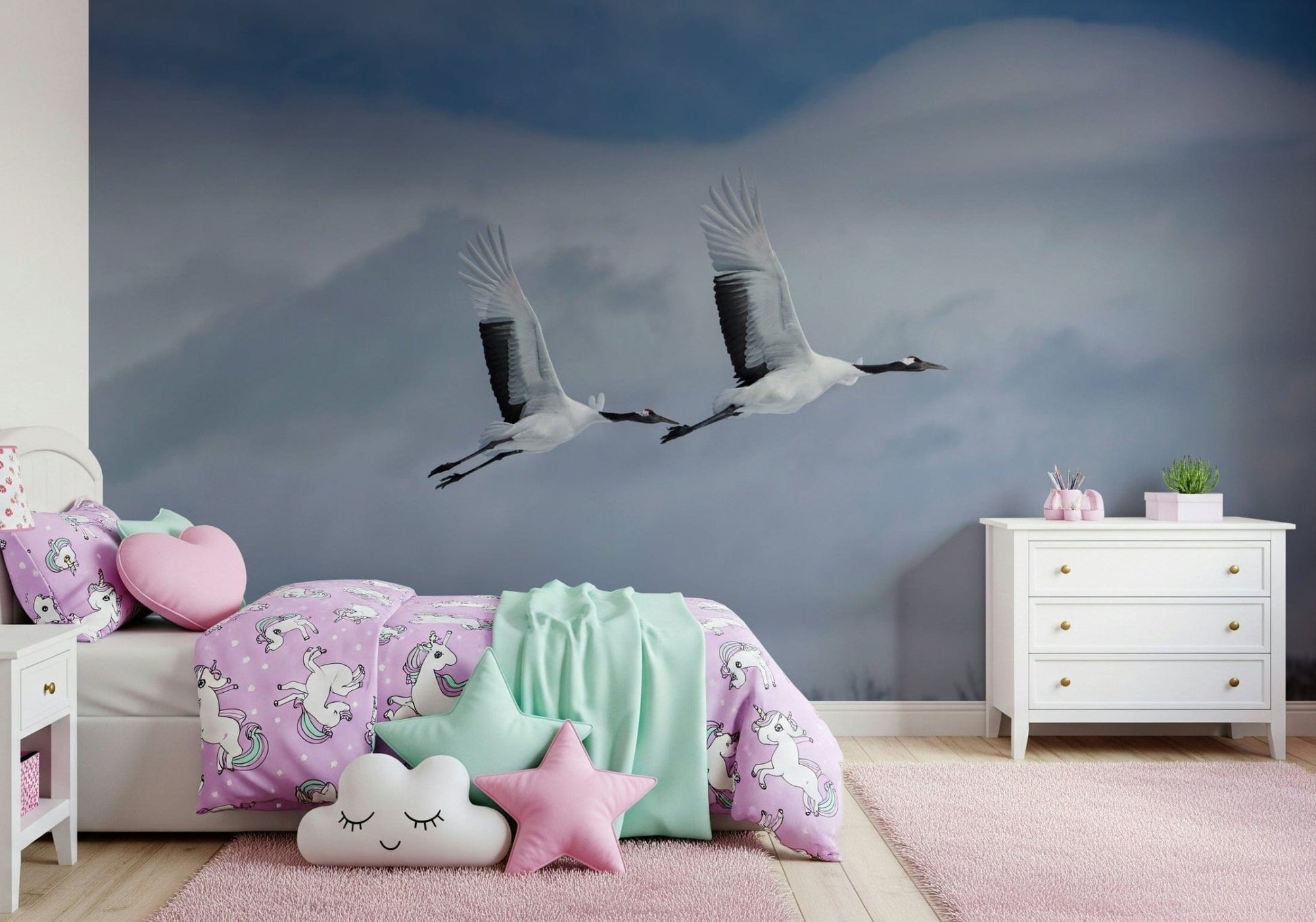 Soft sky and bird wall mural in a contemporary dining area.