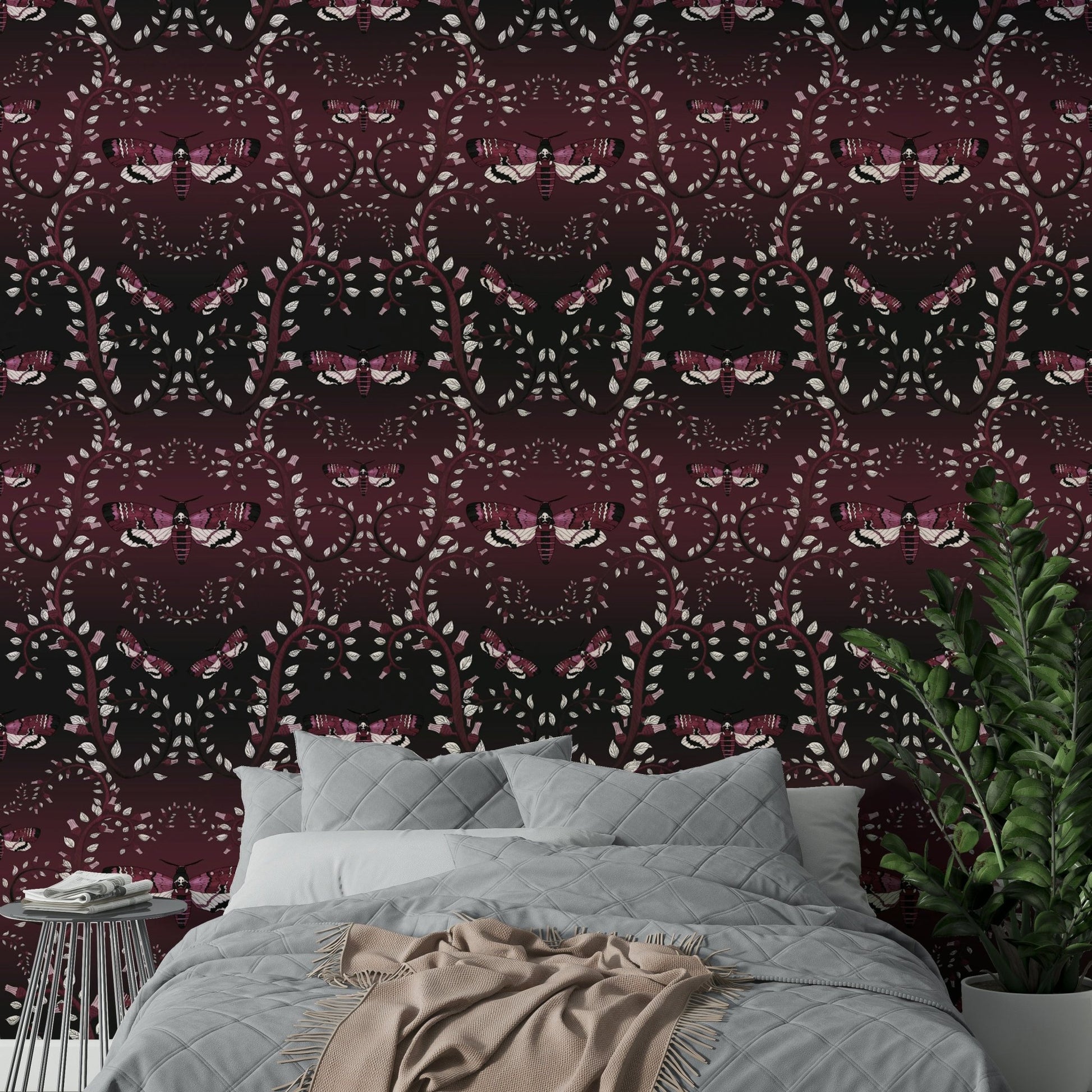 Dramatic moth-themed wallpaper in rich crimson hues.


