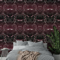 Dramatic moth-themed wallpaper in rich crimson hues.

