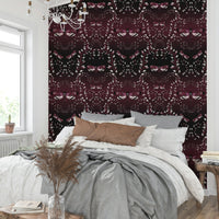 Sophisticated wallpaper featuring moth silhouettes on crimson.


