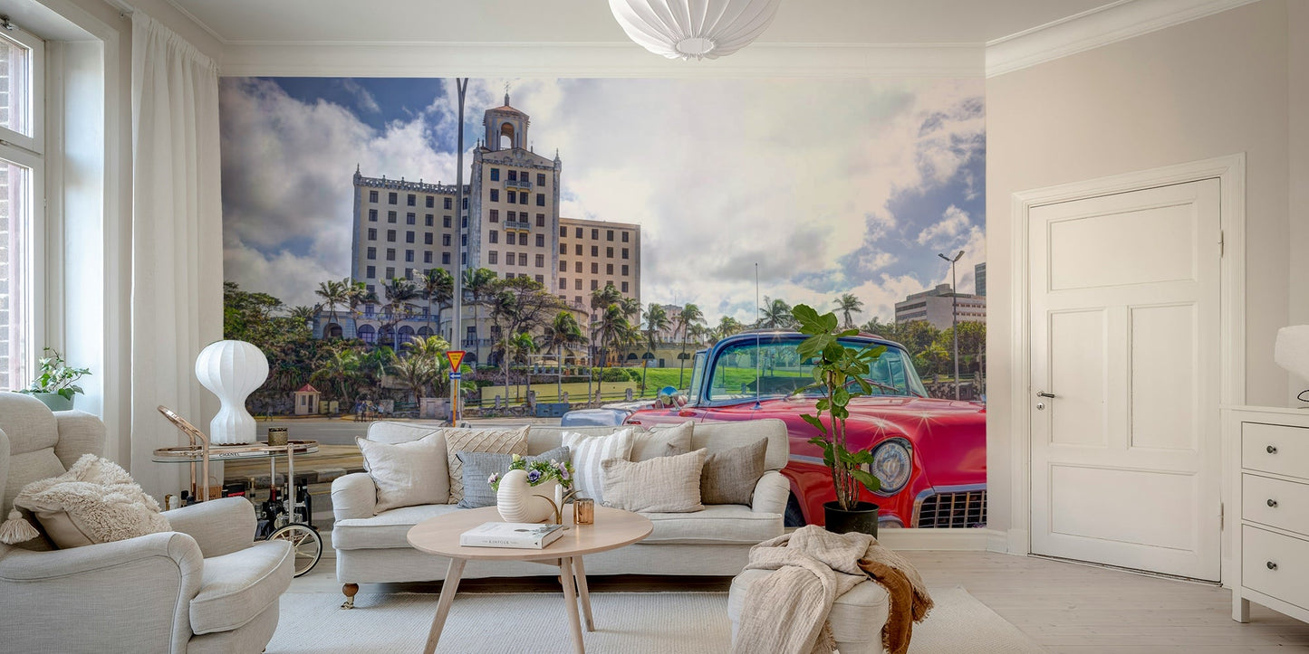 An energetic wall mural with a view of a street in Cuba.

