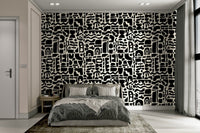 A bedroom with a unique, minimalist wall design

