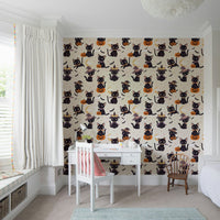 A repeating pattern of cute Halloween cats and pumpkins.
