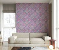 A bedroom with the floral tile mural behind the headboard.