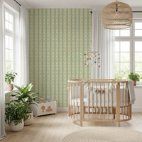 Nursery corner framed by Daisy Chain Delight Wallpaper and delicate cream bloom repeats