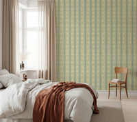 Daisy Chain Delight Wallpaper softens a bedroom wall with calm floral stripe detail