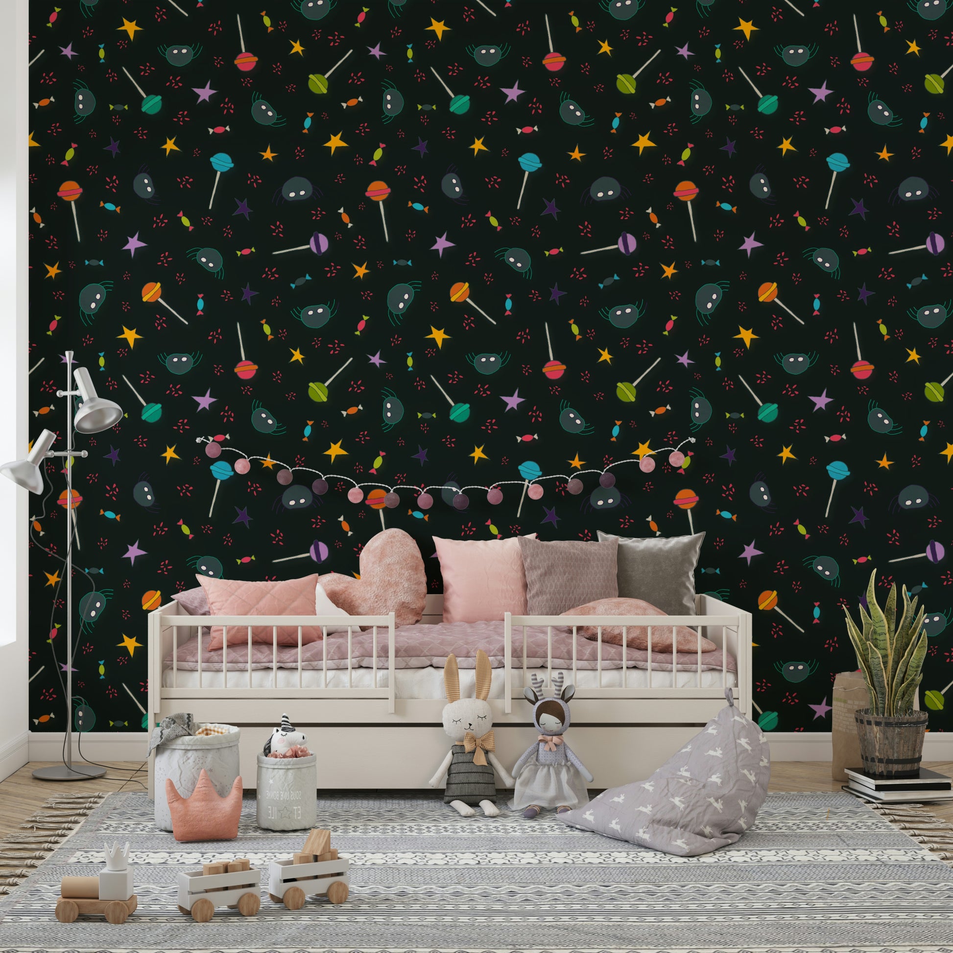 An angled shot of a wall with dark, whimsical wallpaper

