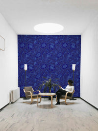 A full-wall mural of a moody floral pattern.
