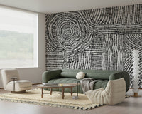 Contemporary geometric wallpaper for a sleek apartment lounge area.
