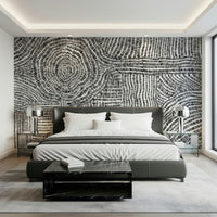 Artistic maze pattern wallpaper for a creative home studio environment.