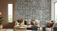 Symmetrical pattern wallpaper for a high-ceilinged foyer entry wall.