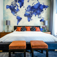 Artistic watercolor atlas wall mural with faded indigo continents