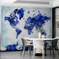 Deep blue watercolor world map wallpaper with artistic paint splatters