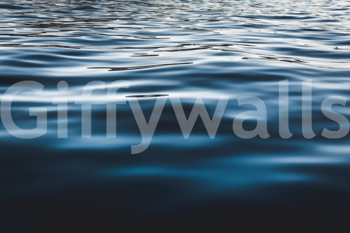 Corner of a hallway brightened by the striking Deep Blue Waters wallpaper for walls.