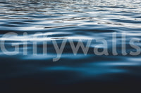 Corner of a hallway brightened by the striking Deep Blue Waters wallpaper for walls.