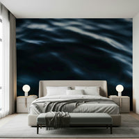 Dining room with expansive ocean wave mural.
