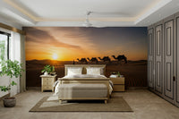 Scenic wallpaper with a line of camels

