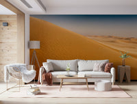 Soft sand gradient wall mural in a bright open-plan dining area.